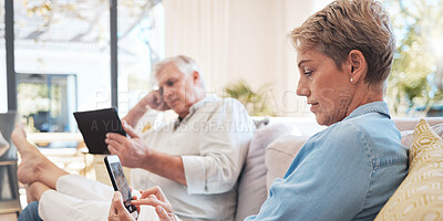 Buy stock photo Relax senior couple on sofa with smartphone and tablet technology to watch film while networking on social media with home wifi. Elderly woman and man on couch with digital or online internet content