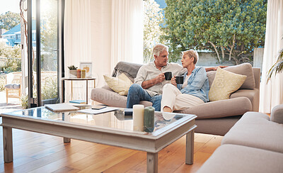 Buy stock photo Relax, retirement and coffee with elderly couple bonding on a sofa, enjoying a peaceful morning in their living room together. Love, man and woman enjoying, break, relationship and cozy conversation