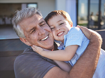 Buy stock photo Happy, smile and grandfather hugging his grandchild while playing together at the family home. Happiness, playful and elderly man in retirement embracing and bonding with his toddler grandson.