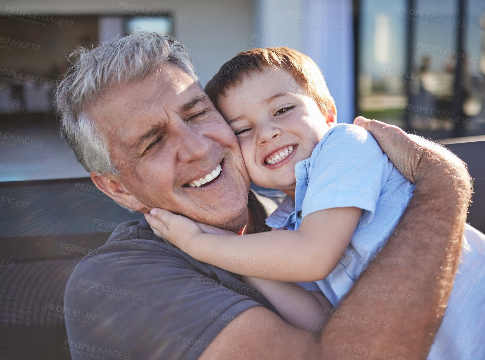 Buy stock photo Happy, smile and grandfather hugging his grandchild while playing together at the family home. Happiness, playful and elderly man in retirement embracing and bonding with his toddler grandson.