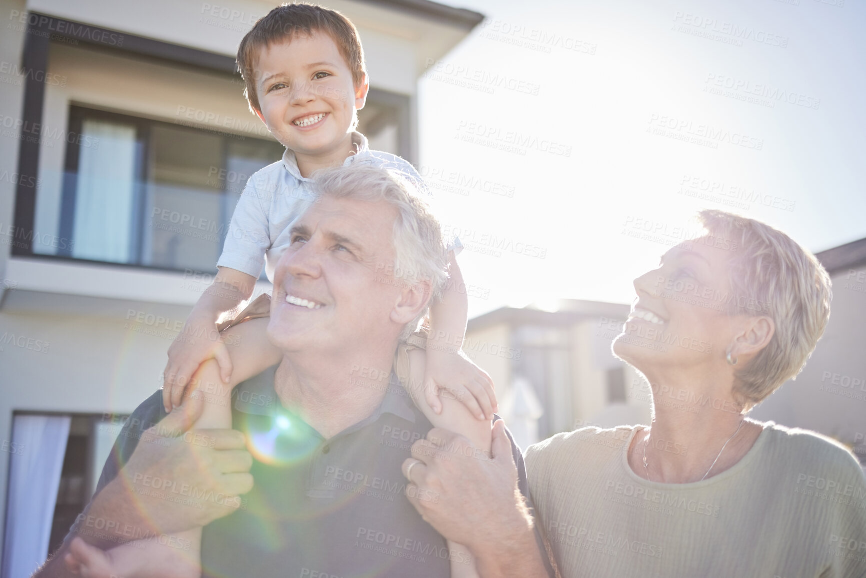 Buy stock photo Children, family and love with a boy and his grandparents playing outside in the garden of their home during a visit. Kids, happy and senior with a male child on the shoulders of his grandfather