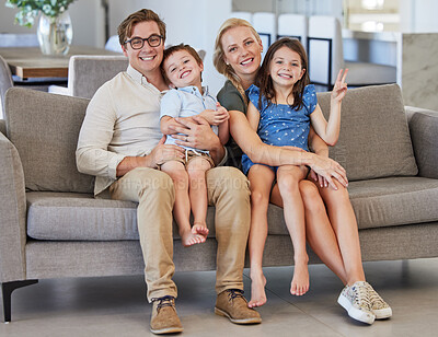 Buy stock photo Mother, kids and father in a happy family portrait on sofa in a lovely home and enjoying quality time in the living room. Happiness, smile and young parents with smiling children relaxing together 