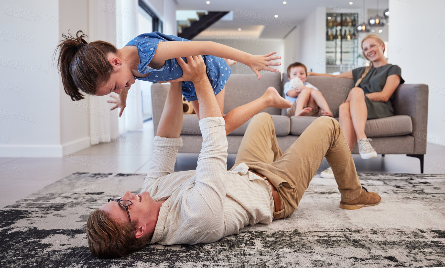 Buy stock photo Family, play and girl in the living room with boy and mom on the sofa in the living room. Trust, love and support as happy child having fun, laugh and joy with her dad at the family home in the loung