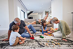 Family care, children love and grandparents happy with toys in living room with kids, smile train game and teddy bear in house. Mother and father relax on couch with elderly people and sibling games