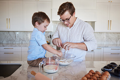 Buy stock photo Father, son and baking teamwork on kitchen counter together love to bond, food and cooking flour, milk and egg pastry. Fun, smile and happy dad teaching kid healthy cookies bake recipe in family home