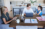 Family, laptop and work at the table together in the dining room at their modern home. Mother working on a business project while father helping child with online school or elearning on a computer.