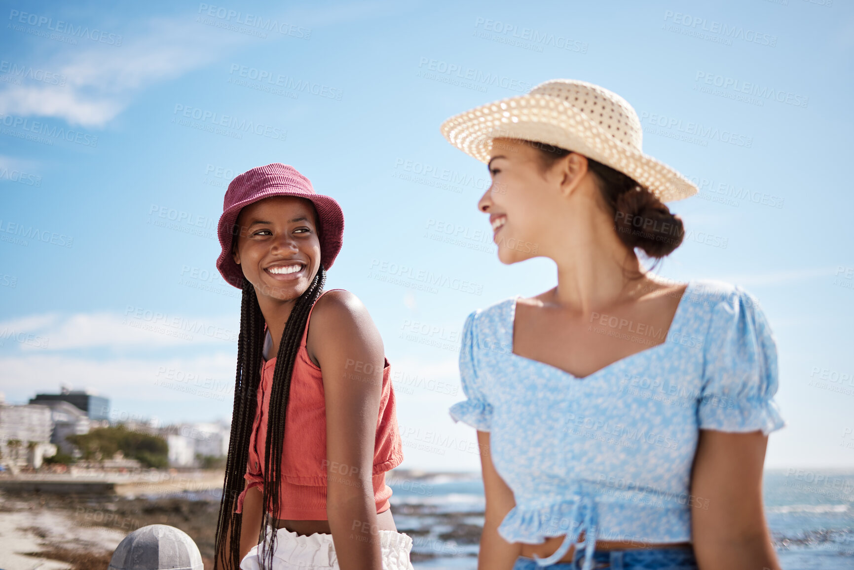 Buy stock photo Summer, travel and girl friends at beach to relax with sun hat fashion enjoying holiday. Young women friendship with black woman and latino lady enjoying ocean vacation sunshine together.