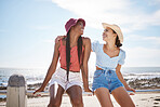Women on travel to beach smile, friends on vacation pose with ocean and blue sky in background. Girl on holiday with happy friend in summer time go to sea to enjoy sun, water and nature together