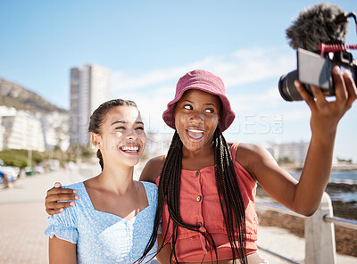 Buy stock photo Influencer woman friends on beach live streaming beach holiday or vacation for social media in city, summer and blue sky. Gen z girl couple or people in selfie portrait or outdoor podcast near ocean