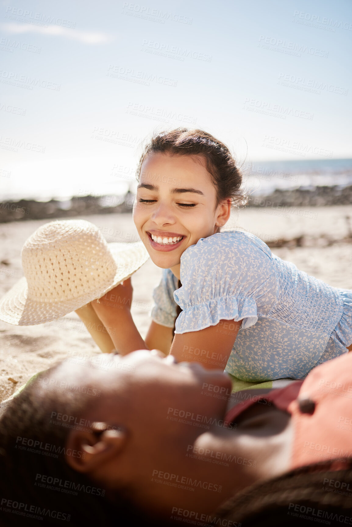 Buy stock photo Summer, beach fun and female friends lying on the sand while talking, laughing and relax on a seaside vacation together. Diversity, friendship and bond between women on holiday with fun in the sun