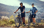 Couple, bicycle and adventure trail on a mountain for outdoor fitness, health and exercise. Cardio, cycling and sport people with healthy, workout and active lifestyle standing with bikes in nature.