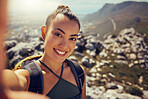 Portrait, happy and woman hiking with a selfie in nature on a mountain during summer. Face, fitness and exercise latin woman or tourist smile while exploring during a trekking outdoor with backpack
