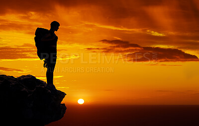 Buy stock photo Dark silhouette, mountain travel and sunset on hiking adventure in nature, sky orange while trekking with backpack and freedom on cliff. Person on holiday in Africa walking on summer journey