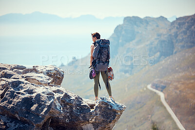 Buy stock photo Hiker, adventure and mountain top of a woman in rock climb, view and backpacking in nature. Active female traveler on trekking or hiking journey standing on cliff with beautiful view of the outdoors