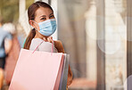 Shopping, medical mask and portrait of woman with shopping bags, smile or happy with sale luxury designer clothes. Rich customer, retail and Asian girl with discount, fashion or store sales in street