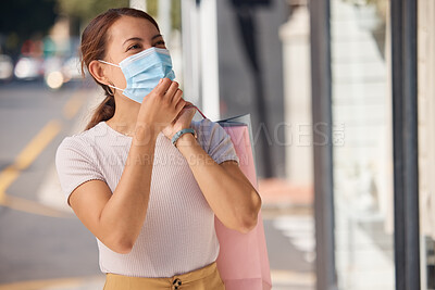 Buy stock photo Woman, shopping and face mask for covid with retail bags outdoor in a urban city. Rich customer, consumer spending and wealthy female person in street outside a store buying luxury fashion