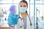 Covid compliance, medical doctor and woman with face mask and thermometer check for safety and protection before entry in a hospital. Portrait of healthcare worker treating coronavirus
