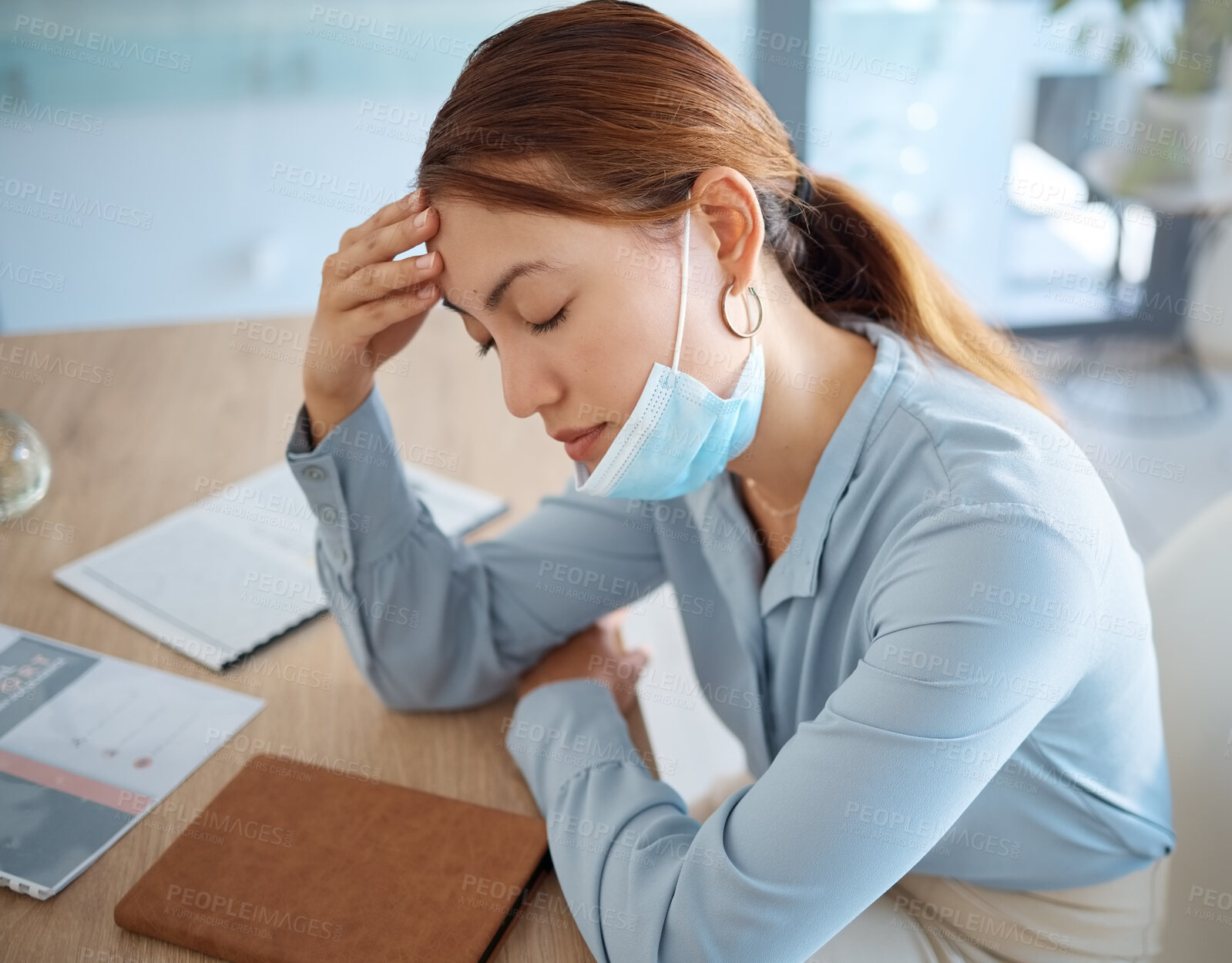Buy stock photo Stress, covid fatigue and woman with headache pain at in the office at work suffering from illness and sickness virus. Tired, mental health and person with migraine sleeping on the job in a mask