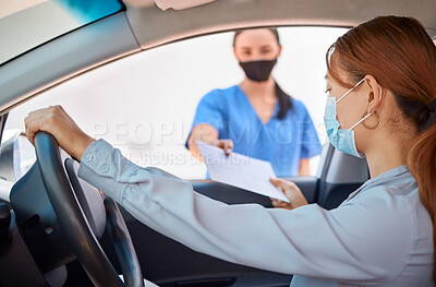 Buy stock photo Covid test in car and drive thru, nurse giving patient forms to fill in. Woman in vehicle wearing a mask and taking documents from medical worker. Masks, coronavirus and testing on remote site