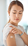 Healthcare, covid and vaccine with woman and bandaid on arm for medical, patient and wellness against virus. Medicine, support and health with girl after vaccination for sick, flu or illness 
