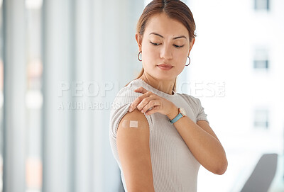 Buy stock photo Woman with plaster on arm from covid vaccine, medical injection and corona virus cure for immune system, wellness and clinic healthcare. Asian female patient with bandaid, vaccination and flu risk