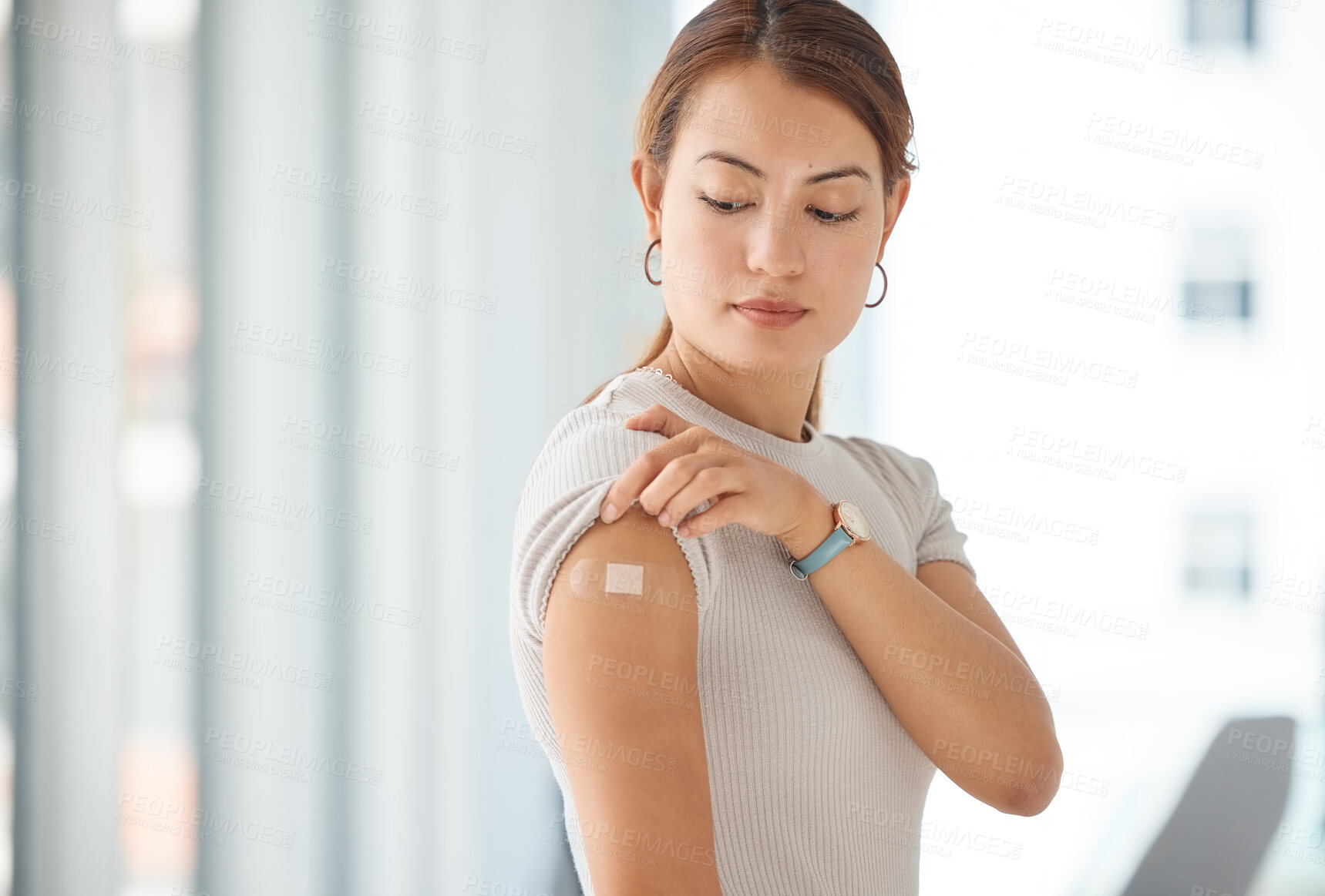 Buy stock photo Woman with plaster on arm from covid vaccine, medical injection and corona virus cure for immune system, wellness and clinic healthcare. Asian female patient with bandaid, vaccination and flu risk