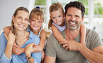 Happy, smile and portrait of relax family on home living room sofa bonding, having fun and enjoy quality time together. Happiness, love and happy family youth kids or children hug mother and father