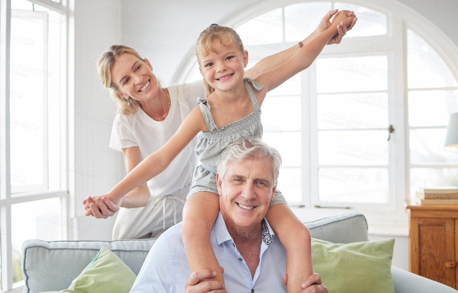 Buy stock photo Love, play and portrait of happy family with senior man bond, enjoy quality time and have fun together. Mother, smile and kid girl playing on grandparent or grandfather's shoulder in home living room