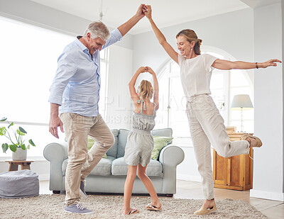 Buy stock photo Girl dance with grandparents on living room, have fun and happy time in home. Senior man, smile in house with woman and child, dancing and playing together in their lounge at family home
