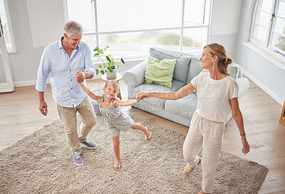 Buy stock photo Family or grandparents dancing with child in living room for wellness, healthy body movement and growth development in retirement lifestyle. Happy energy, grandmother and grandfather dance with kid