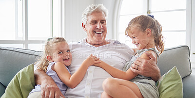 Buy stock photo Happy family, retirement and old man playing with children on the sofa bonding, happiness and laughing together. Smile, elderly and grandpa with little girls enjoying quality time on a couch at home