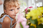Flower smell and girl in spring portrait with beautiful bouquet of fresh daisies aroma in house. Young child enjoying sweet and natural scent of bright floral garden petals in family home.

