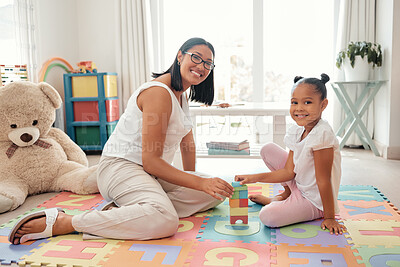 Buy stock photo Mother, learning and child toy in home of knowledge development and education in a bedroom. Portrait of a happy family smile play a education game to build balance and children motor skills at home