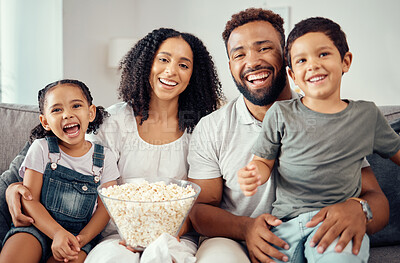 Buy stock photo Love, laugh and watching tv or a movie with a happy family eating popcorn, having fun and smile together in home. Portrait of latino parents and children, enjoy the weekend and feeling carefree
