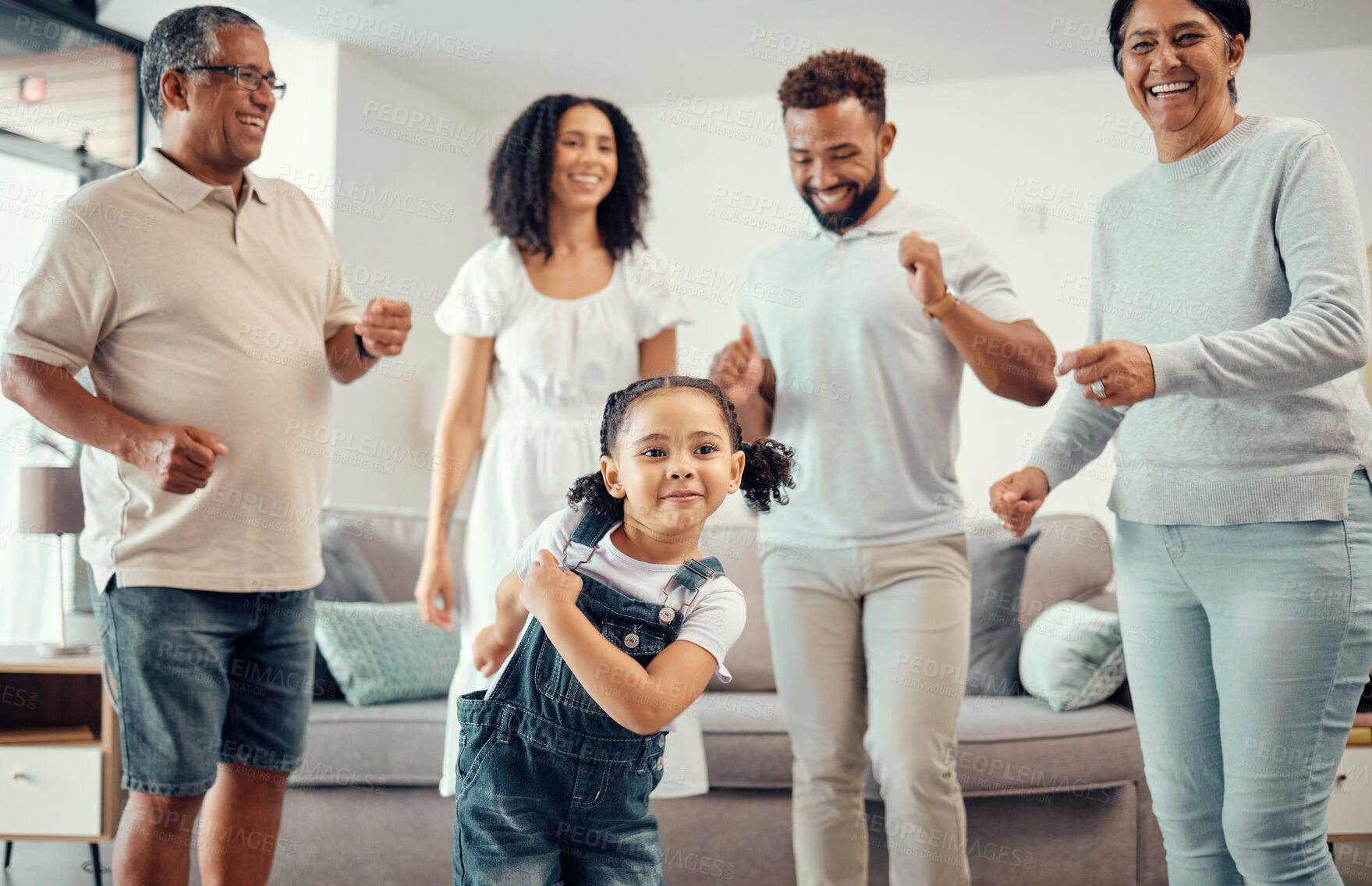 Buy stock photo Happy, family and dancing in playful living room fun together with entertainment in happiness at home. Group of people in relationship bonding, smiling and joyful funny dance at the house