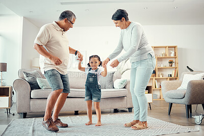 Buy stock photo Happy grandparents, girl and dance holding hands in home living room with music having fun sharing love, energy and bond. Retired man, woman and kid playing, caring and enjoying active time together.