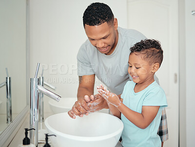 Buy stock photo Soap, father and child cleaning hands for hygiene, wellness and positive morning routine in a healthy lifestyle. Happy, smile and dad enjoys washing fingers with young kid, boy or son in the bathroom