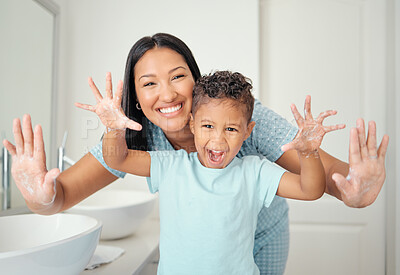 Buy stock photo Mother and son in bathroom with clean hands, open palms that are cleaned and covered in foam teaching child hand washing. Cheerful parent help kid with hygiene for hand with water, soap and bubbles.