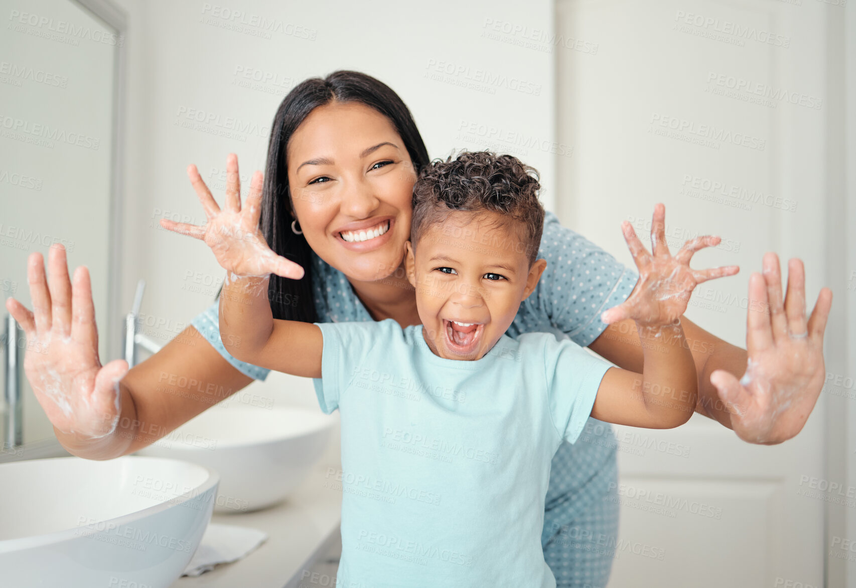 Buy stock photo Mother and son in bathroom with clean hands, open palms that are cleaned and covered in foam teaching child hand washing. Cheerful parent help kid with hygiene for hand with water, soap and bubbles.