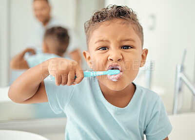 Buy stock photo Portrait of learning child cleaning and brushing teeth in home bathroom for dental care, tooth care or oral health. Morning routine, child development and life skill education for kid with toothbrush