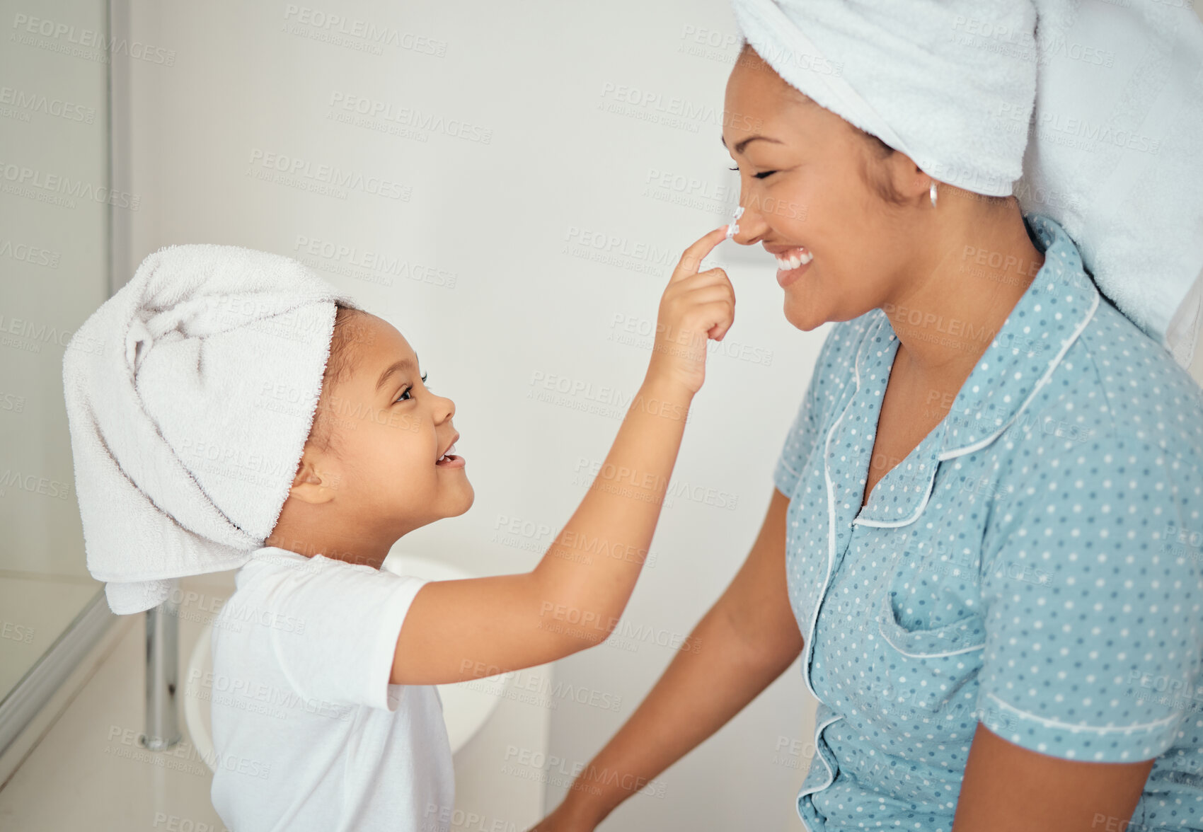 Buy stock photo Mother, face cream and girl child in bathroom apply beauty, cosmetics and lotion product for shower morning routine. Happiness, smile or happy mom and young kid love skincare creme, bonding at home