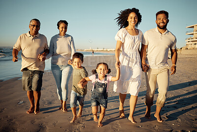 Buy stock photo Portrait of happy family with little kids walking together on beach during sunset. Adorable little children bonding with mother, father, grandmother and grandfather outdoor on summer vacation