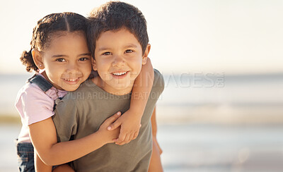 Buy stock photo Happy, smile and portrait of siblings at the beach hugging and playing while on summer vacation. Happiness, ocean and brother giving his sister a piggyback ride while on a seaside family holiday.