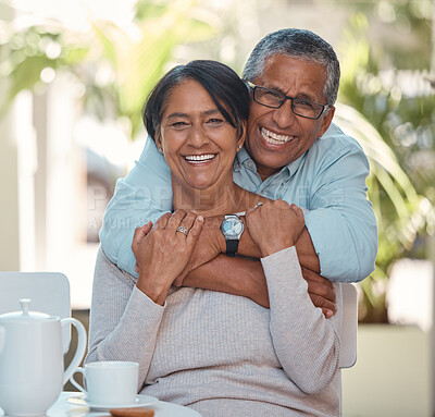Buy stock photo Portrait of elderly couple hug and bonding, happy and enjoying tea break at home together. Retirement, love and smiling man and woman embracing and resting in their house, fun and affection affection