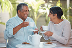 Happy senior couple, laughing and drinking coffee in cheerful fun together at outdoor cafe or restaurant. Elderly man and woman in laugh, tea and conversation bonding in happiness for relationship