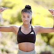 Fitness, strong arm muscles an black woman after a sports workout, training  and exercise in nature. Portrait of a healthy female athlete with  motivation for sport, cardio and muscle strength