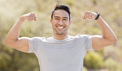 Buy stock photo Sport, fitness and exercise with a flexing man showing his muscles and biceps while proud of his strong build. Workout, training and health with a muscular young male athlete or bodybuilder outdoor