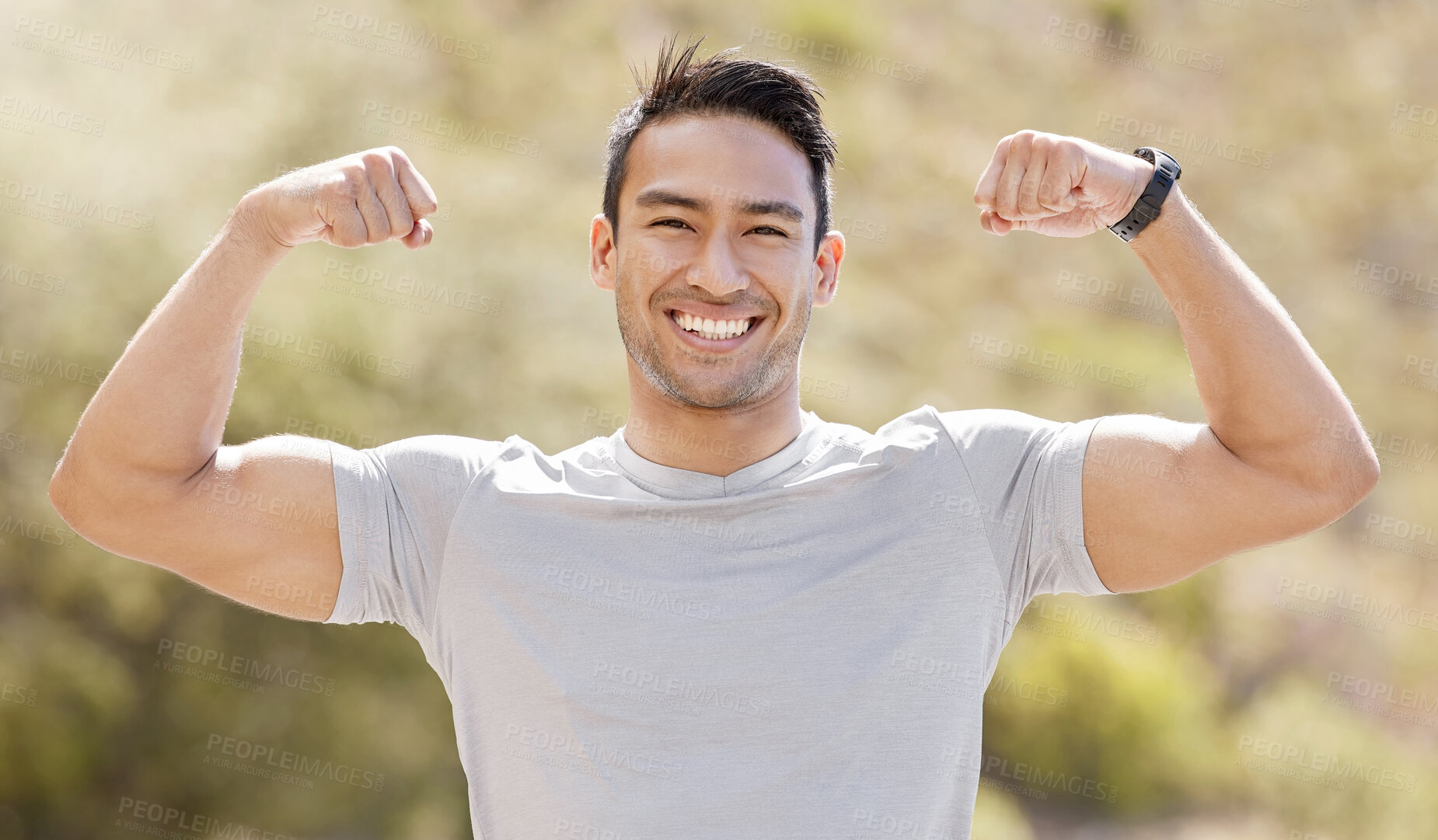 Buy stock photo Sport, fitness and exercise with a flexing man showing his muscles and biceps while proud of his strong build. Workout, training and health with a muscular young male athlete or bodybuilder outdoor