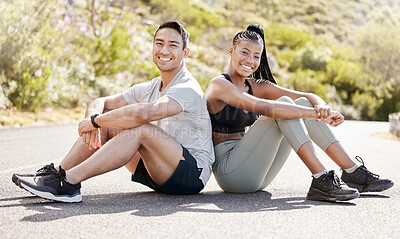 Buy stock photo Portrait of couple resting in the street after workout, running and exercise. Young, smiling and multicultural couple sitting on the road after a run, training or exercising together in urban city
