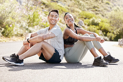 Buy stock photo Health, fitness and friends relax after workout in nature, sitting and talking in a road outdoors. Rest, wellness and conversation with diverse man and woman taking a break together after cardio run